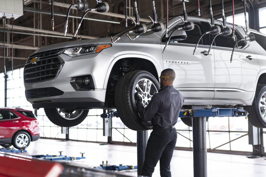 A Toyota service technician installing a tire in Akron, OH