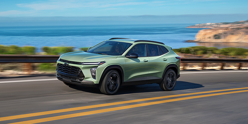 Chevrolet SUV driving coastal highway