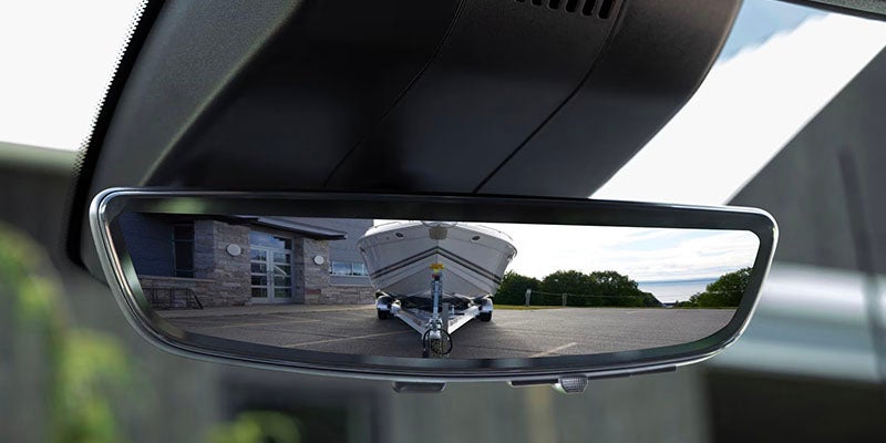 2026 Chevrolet Silverado 2500 HD rearview mirror in Akron, OH, showcasing a high-tech rearview mirror with available camera views for enhanced visibility and safety while driving.